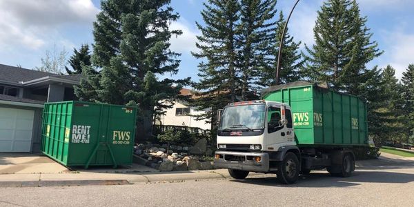 FWS GMC 7500 switching a 30 yard bin.