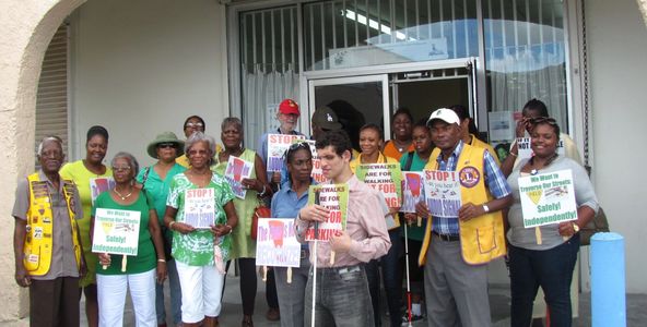 A picture of participants holding signs advocating living independently