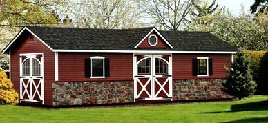 Manor Deluxe, optional clapboard siding, red paint, Vermont field stone, carriage doors, extra door