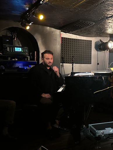 Jazz trio performing live at a cozy jazz club stage.