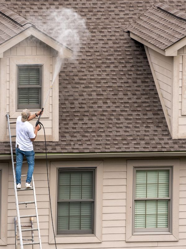 Residential cleaning with a pressure washer, illustrating home maintenance in Hurley, NY