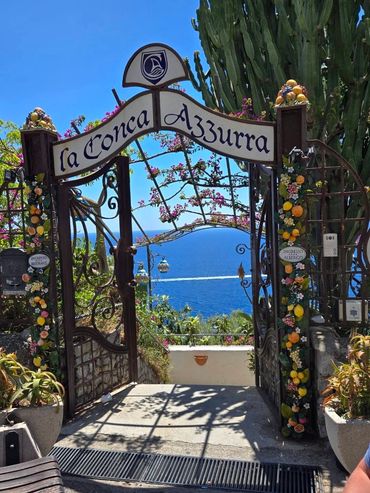 Decorative entrance restaurant gate overlooking the Amalfi coast.