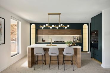 Modern residential project of a kitchen with wooden accents and sleek lighting. Porcelain tiles on the floor