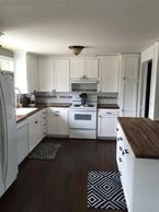 Kitchen renovation, walnut butcher block, painted white cabinets, marble and subway tile, DIY.