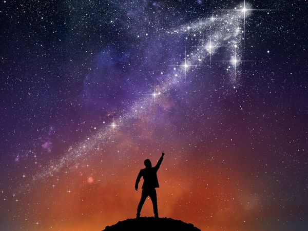 Businessman pointing to a star arrow going upwards