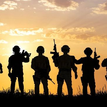 Sunset with Soldiers with gun silhouette