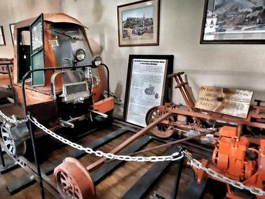 Historic railroad velocipede and track speeder on display at the Railroad Museum of Minot.