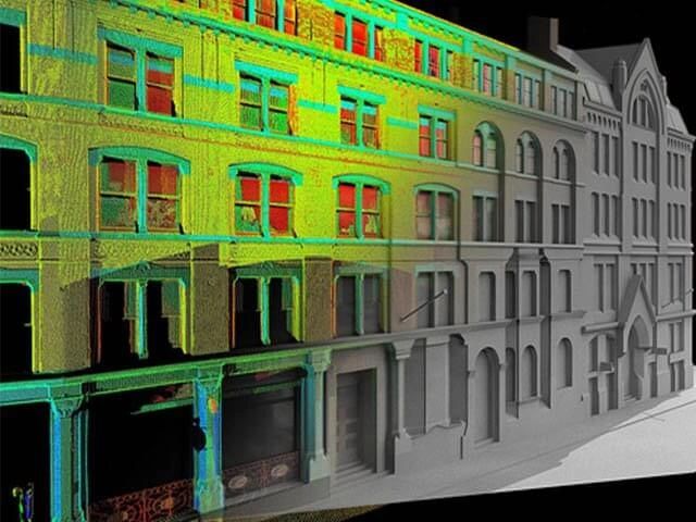 3D building scan with color-coded facade details.