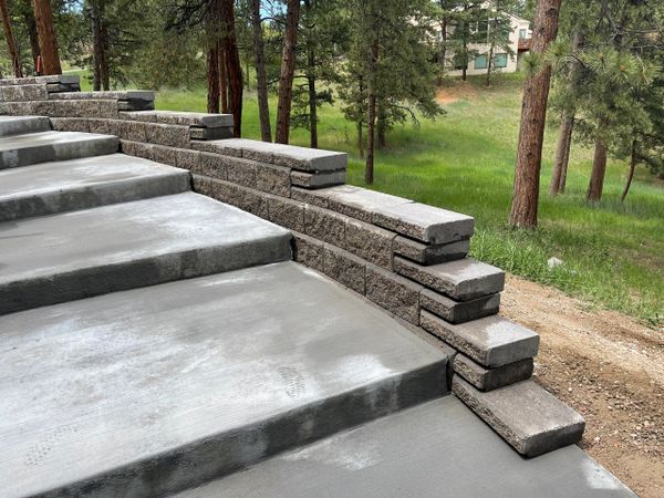 Gray concrete steps with stonework