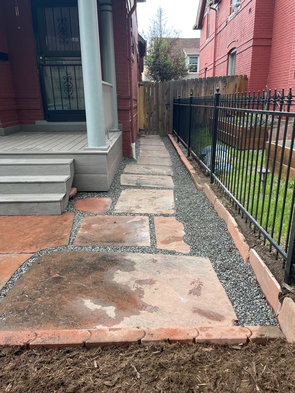 Red flagstone walkway with gray gravel