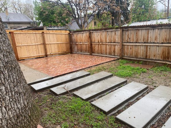 Brick Patio with Gray concrete steps