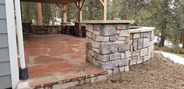 Red Flagstone patio with stone walls