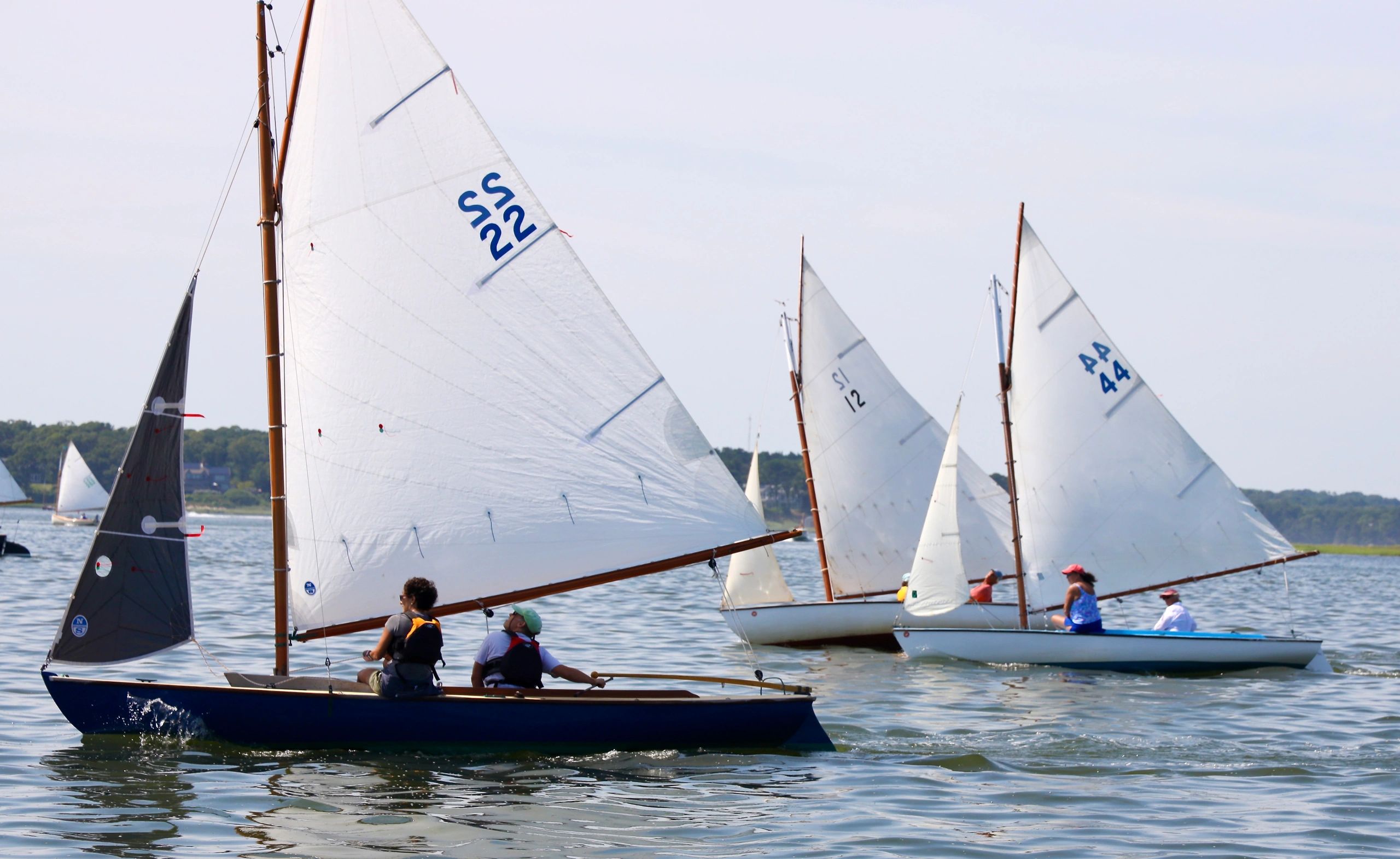 Basy Birds reaching to windward during a Sunday Adult sailing race on Little Pleasant Bay