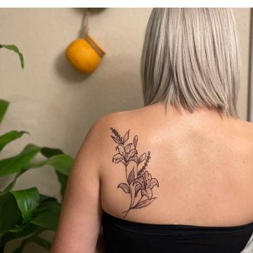 back jagua tattoo lillies 