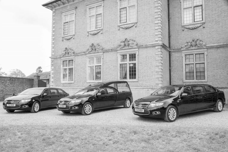 Our fleet of Ford hearse and two limousines