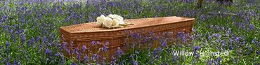 An Eco friendly coffin with with flowers on top