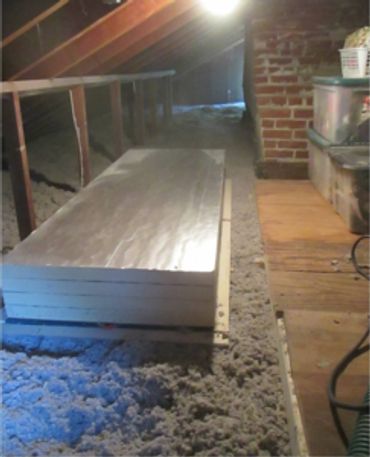 A fully insulated, airsealed attic with a pull down staircase and storage platforms