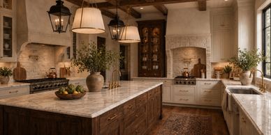 A rustic kitchen with wooden island and warm lighting.