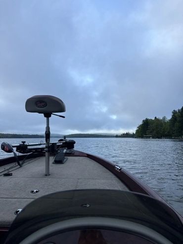 view of a boat with fishing equipment