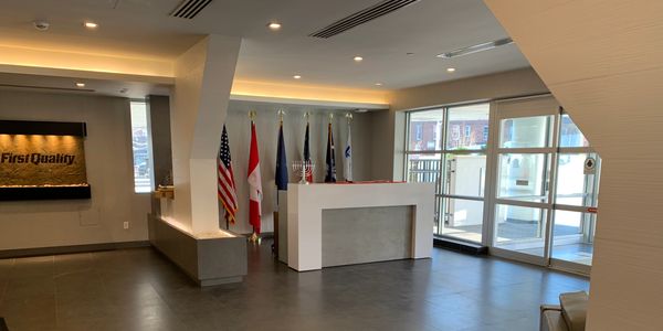 White lobby desk and flags
