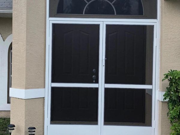 Picture of frame Large square window alongside a white door