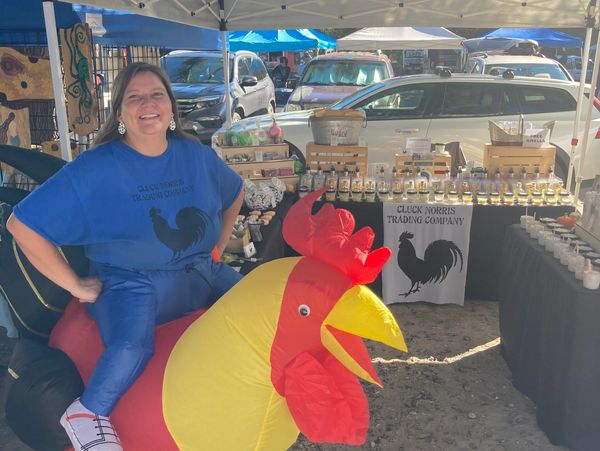 Woman in chicken costume.