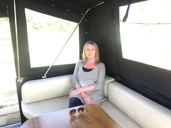 woman relaxing on comfortable white sofa