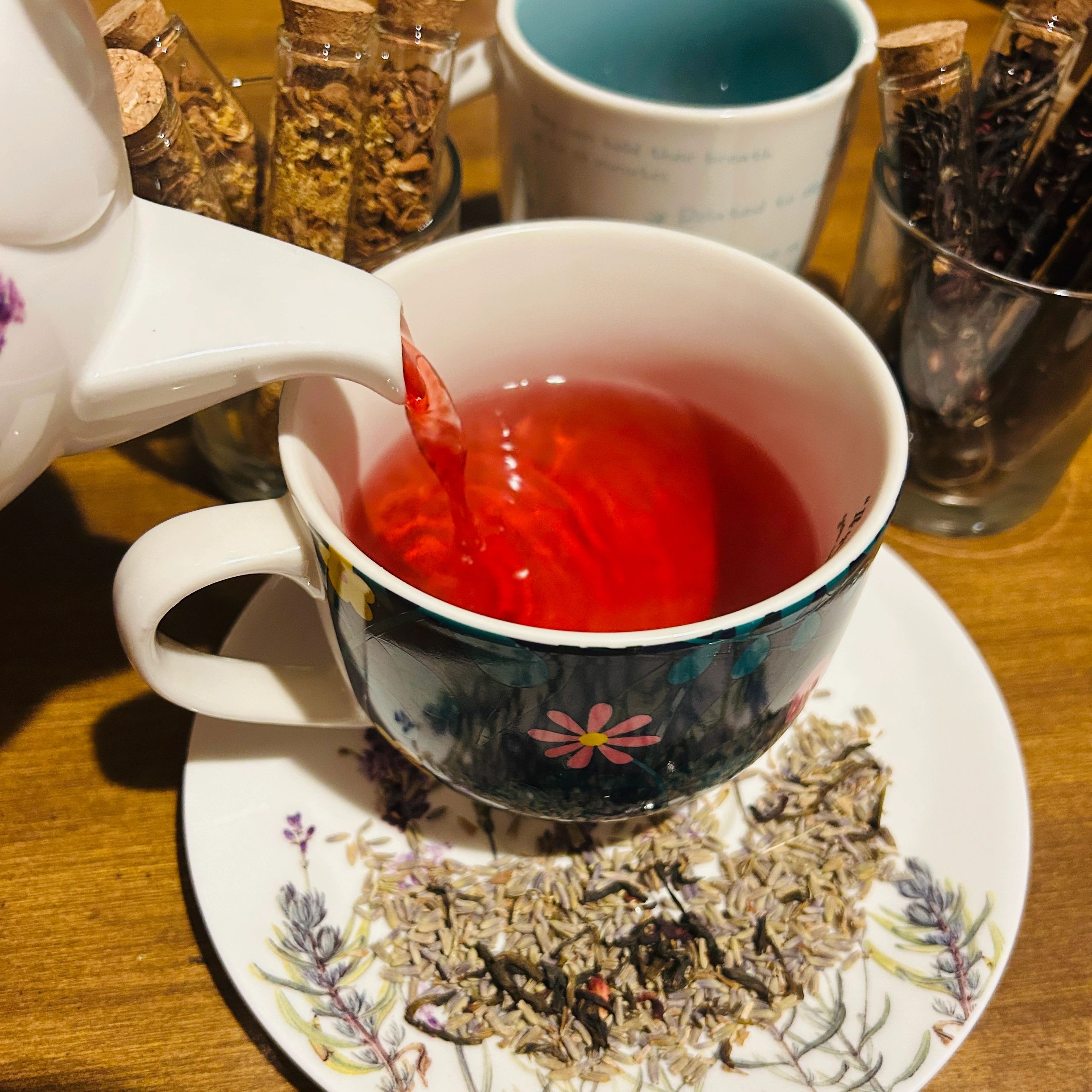 Hot herbal tea pouring into mug
