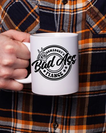 bad ass husband 11oz coffee mug in hand