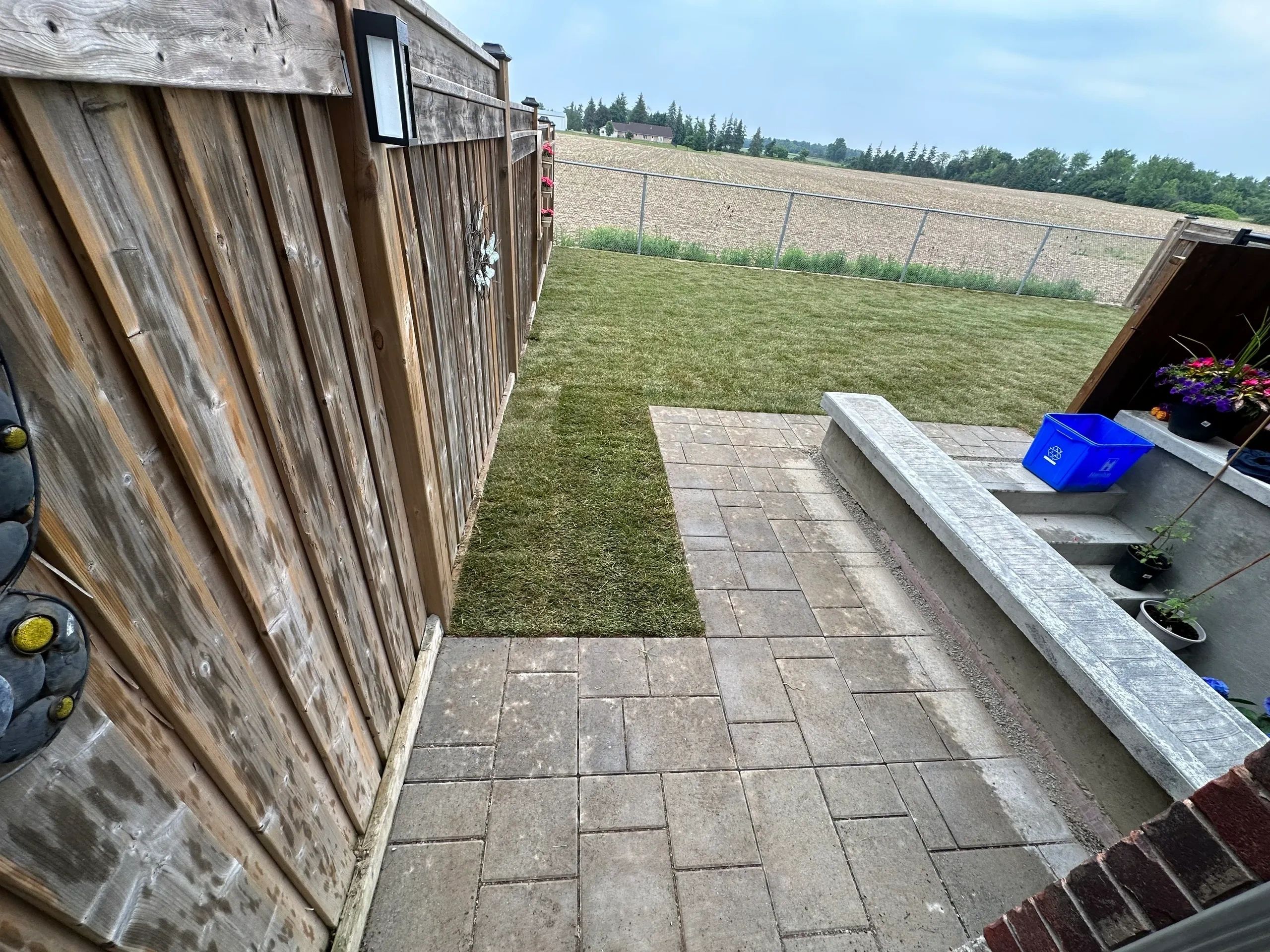 Sod installation, walkway installation,
grass, retaining wall, plants, 