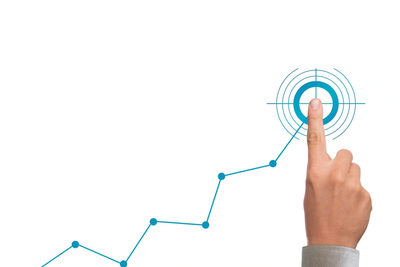 Hand pointing at a target on an upward trending graph line.