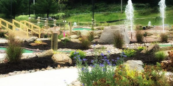 Pine Creek Golf Center has 30 small beds with 400  perennials, bushes, trees, and small boulders!