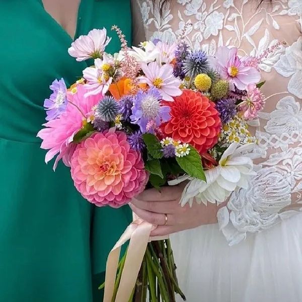 A bride holding a flower bouquet