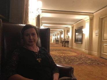 woman wearing oak leaves and acorns ceramic clay necklace by Los Angeles artist Camille Stancin