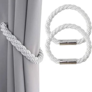 Magnetic tiebacks on curtains.
