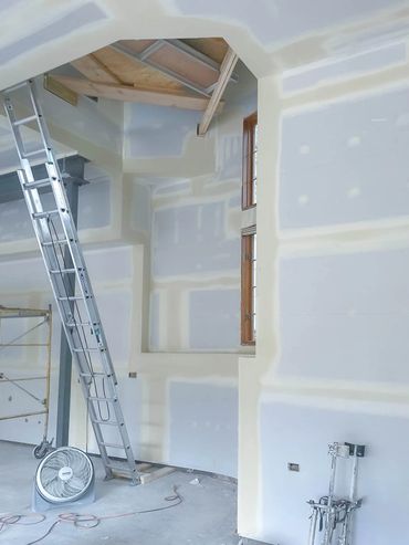 Vaulted ceiling living room renovation with drywall and taping service in St.Charles, IL