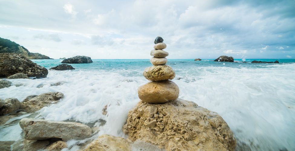 image of zen stones tower in a harmony, nature environment with rushing water
