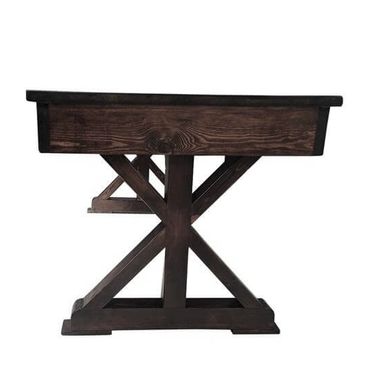 Rustic wooden table with dark finish.