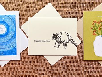 three cards on brown burlap, an Infinite Love, a Happy Birthday Bish, an I'm here for you.