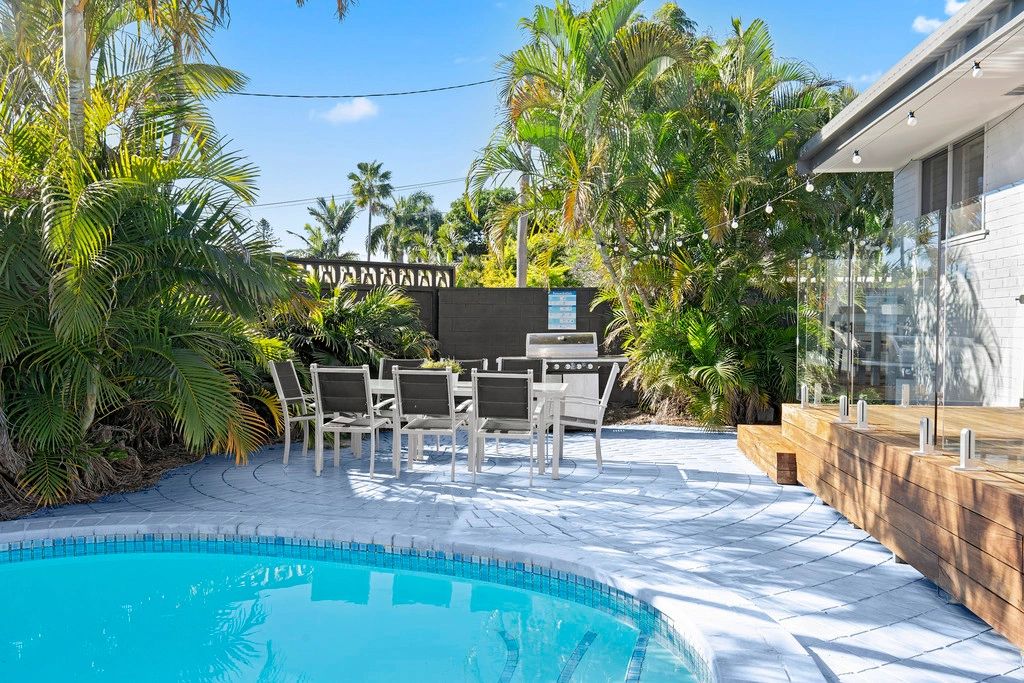 Pool renovation, exterior painting, decking and glass balustrades, gardening in Broadbeach Waters.