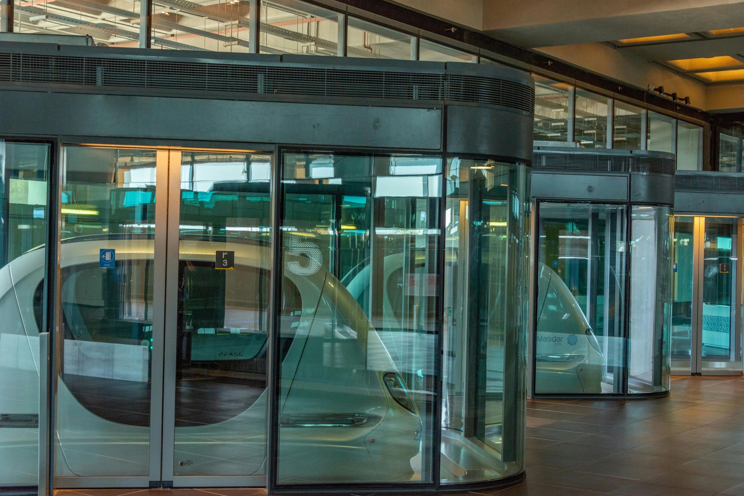 Several automatic sliding doors in a commercial setting