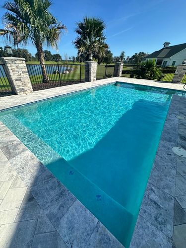 Sparkling swimming pool after algae removal and water balancing