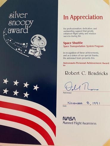 Robert C. Hendricks awarded Silver Snoopy by Astronaut Donald Thomas