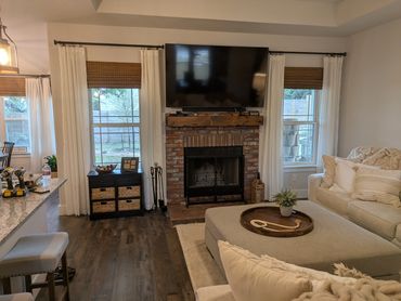 Removed and re-tiled fireplace and installed wood mantel