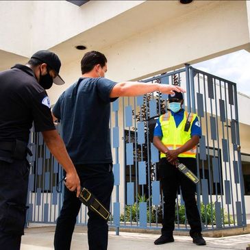 Security Guards clearing the building and entry for added security measures. Additional metal wands