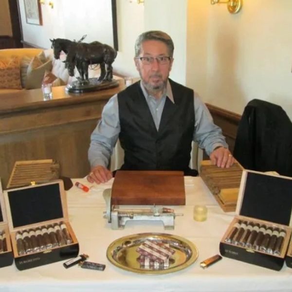 The Owner of Palma Cigars rolling cigars at a private event.