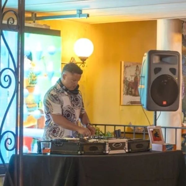 A DJ mixing sounds from the Bar Las Palmas stage