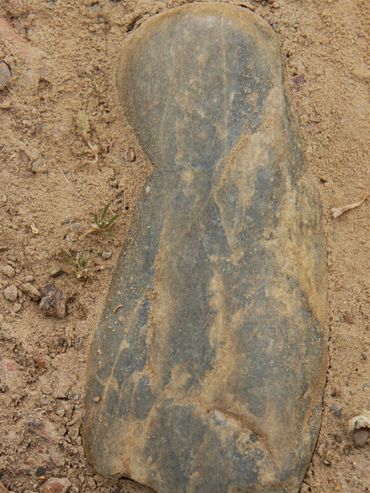 Smooth decorative pattern and further etched near the bottom of the stone