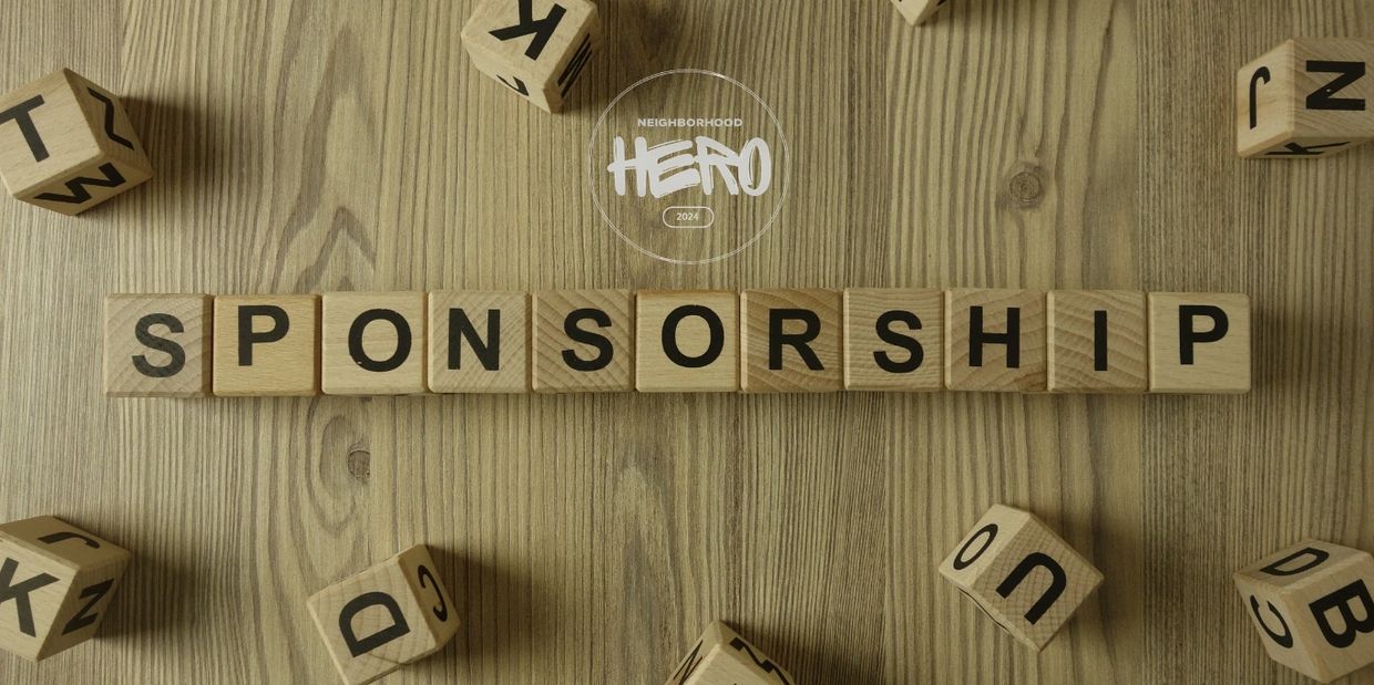Wooden blocks spelling 'SPONSORSHIP' on a table.