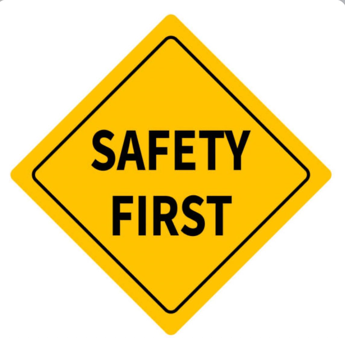 Yellow diamond sign with black text reading 'SAFETY FIRST'.